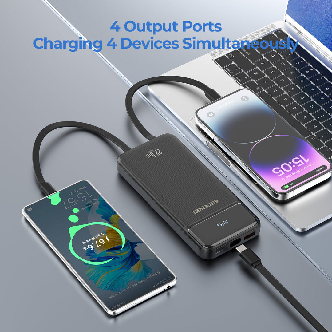Eseekgo power bank with built-in cables charging two phones beside a laptop